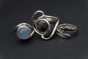 Sterling Silver Rings. From left to right: Blue Chalcedony; Amethyst; Cedar Frond impression in sterling silver